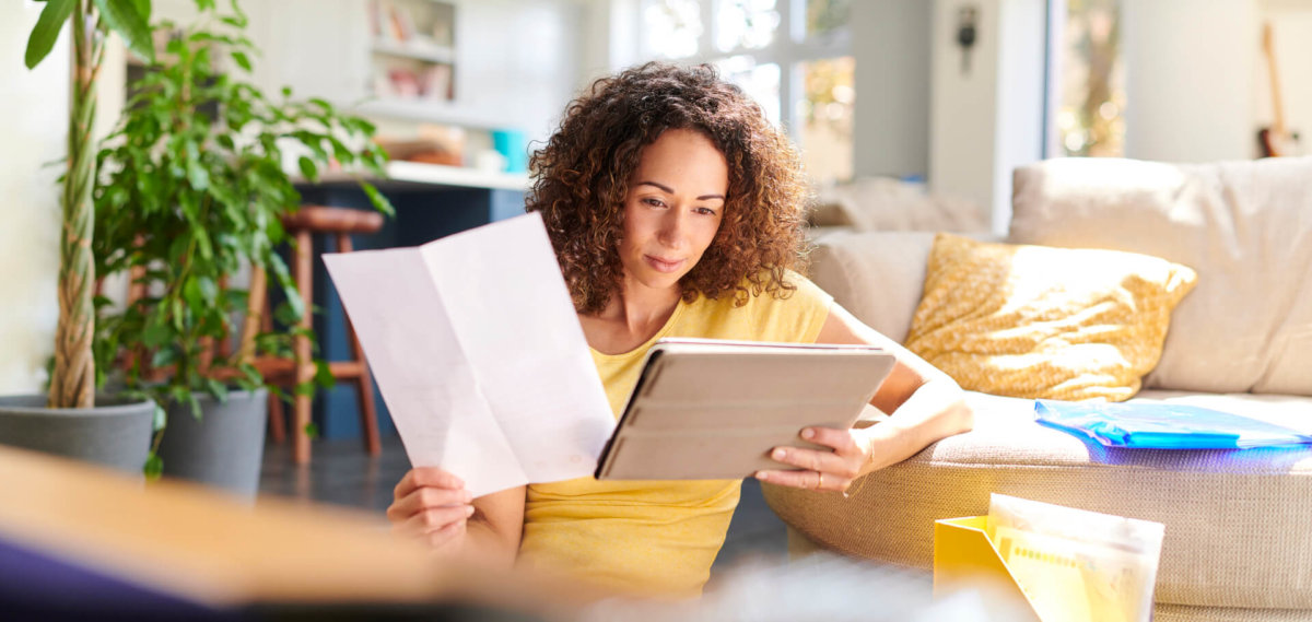 Woman doing paperwork at home