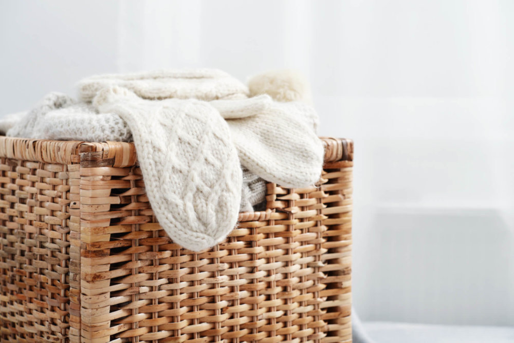 Wicker storage basket with clothes