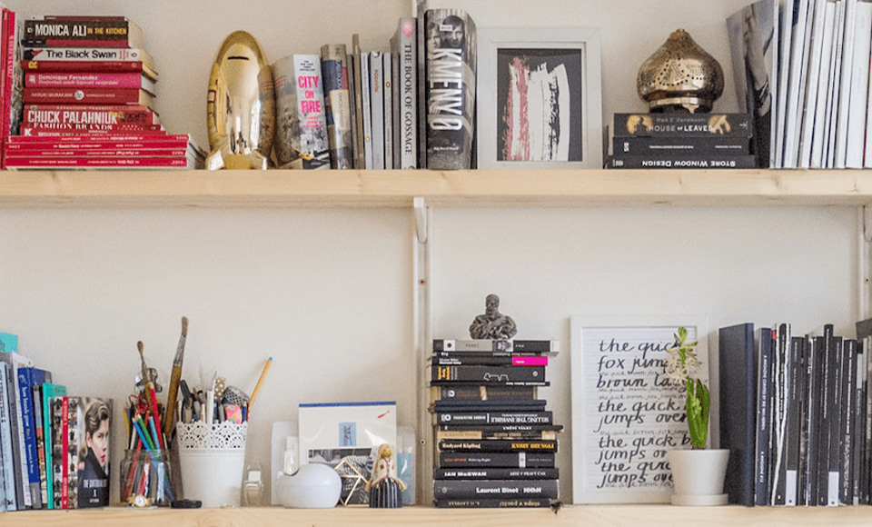 Bookshelves filled with books and decorative items